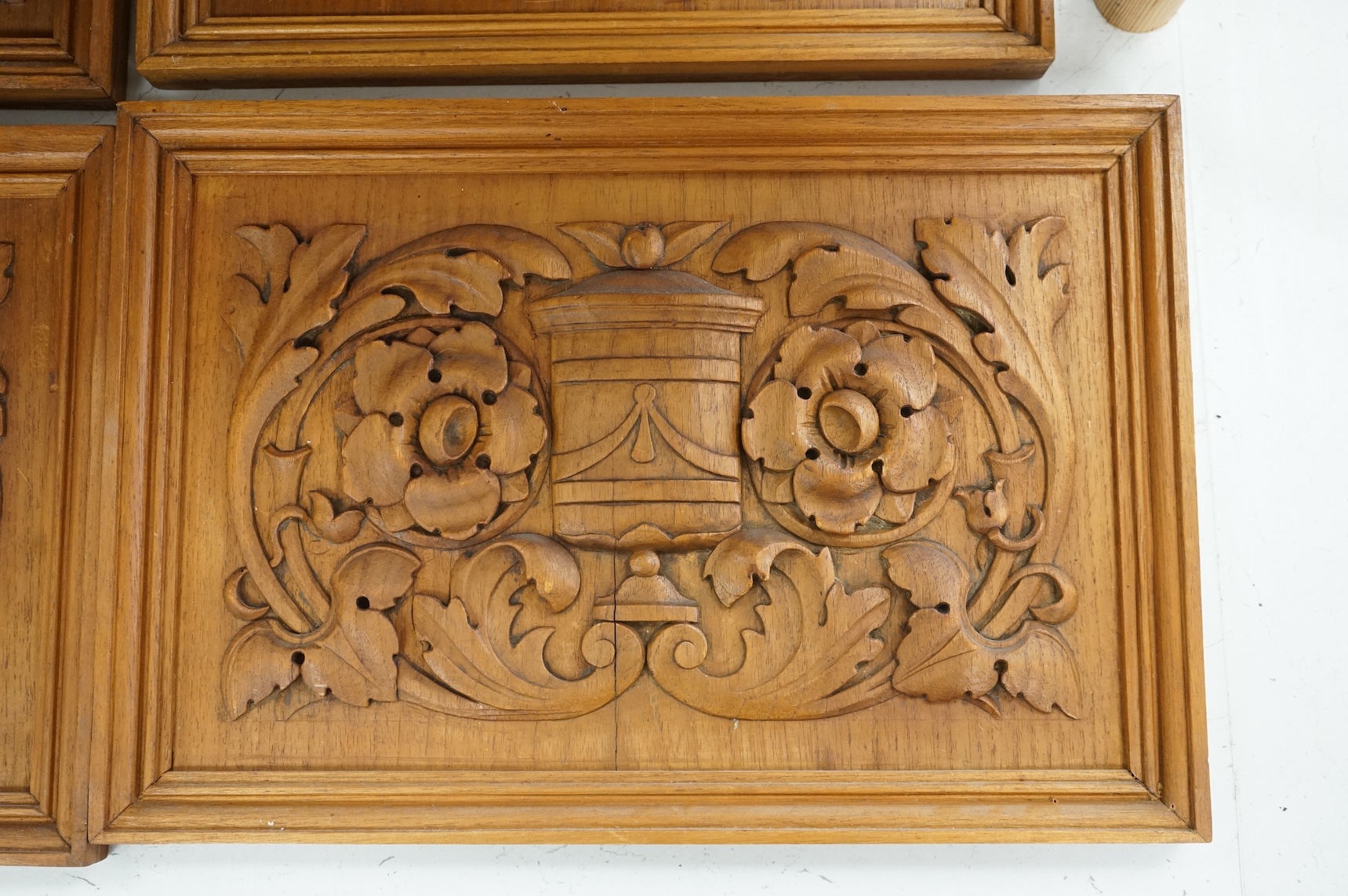 Six carved wood relief plaques, largest 31x46cm